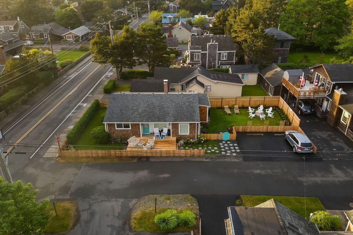 Aerial view of the cottage with private drive parking