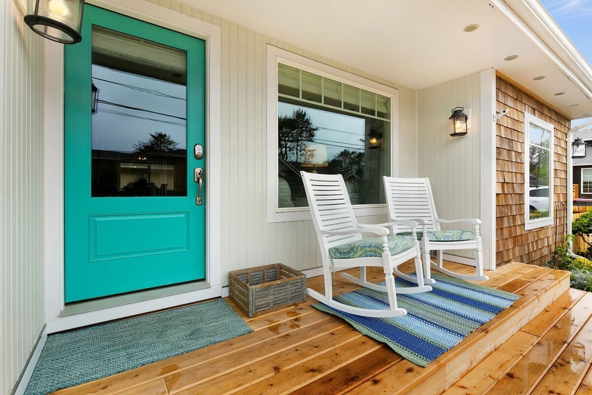 The teal front door and welcoming porch of Beach Blessing